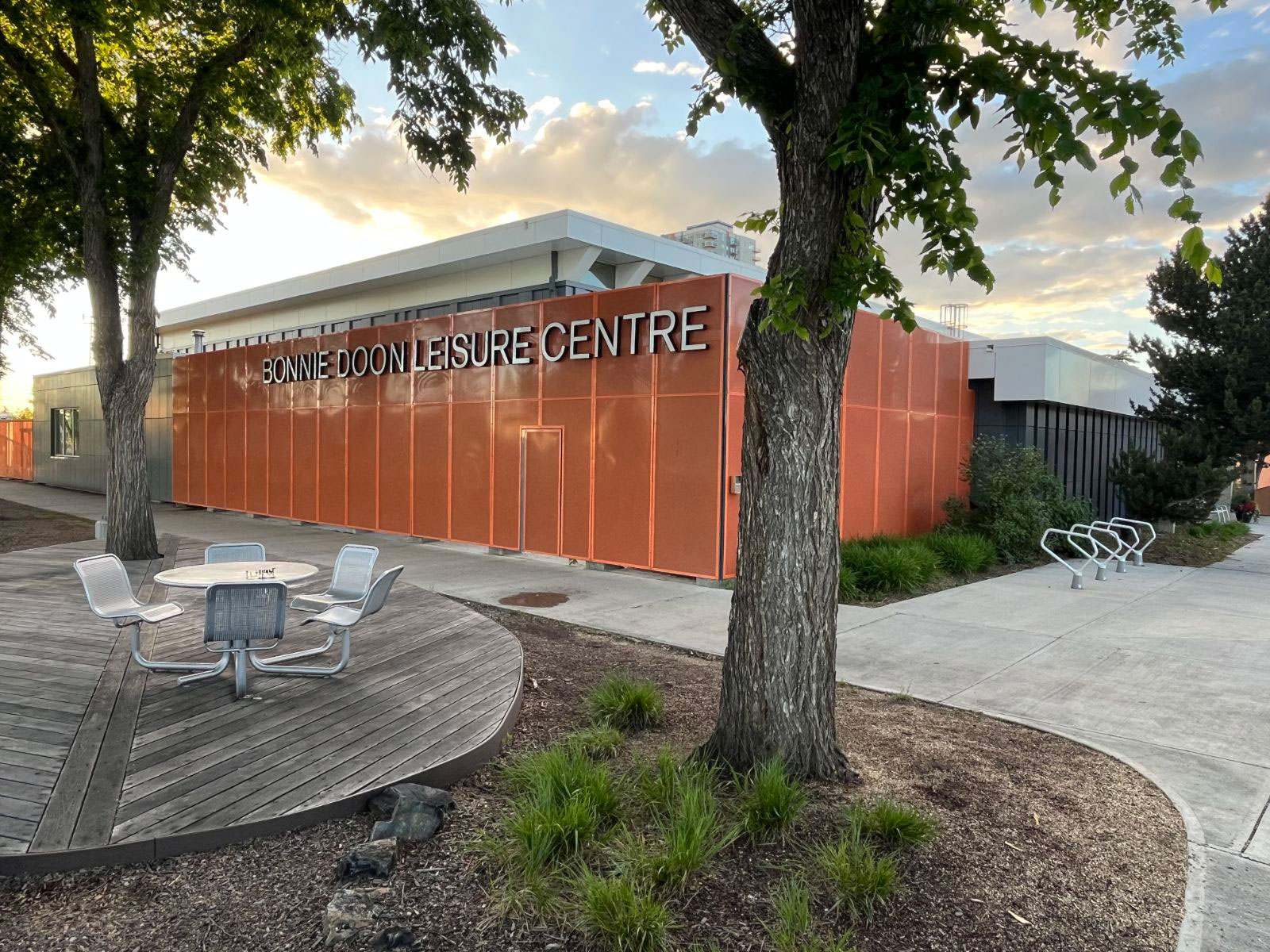 Exterior of leisure centre with small seating area