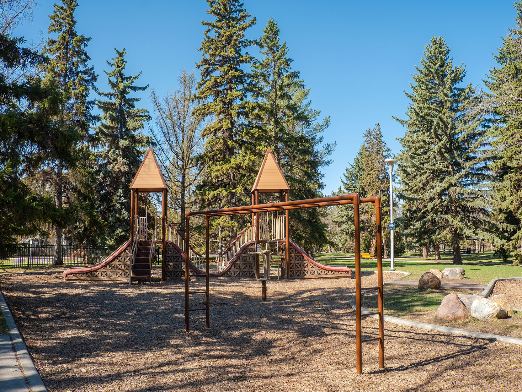 Twin, wooden play structures