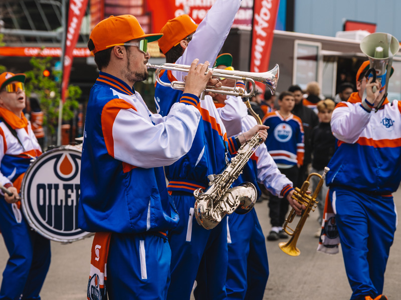 Band wearing Oilers attire plays for crowd