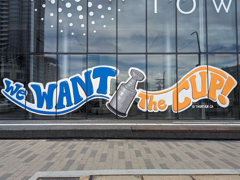 "We want the cup" window painting downtown