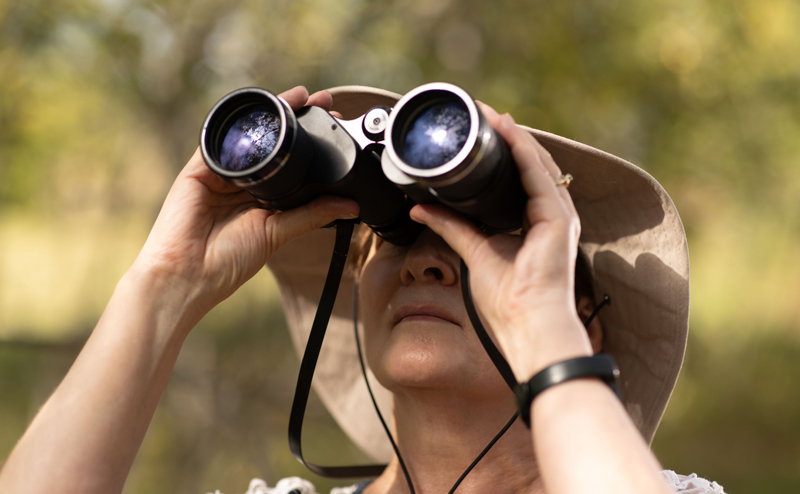 A person using binoculars.