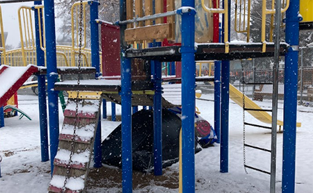 homeless tent under playground set