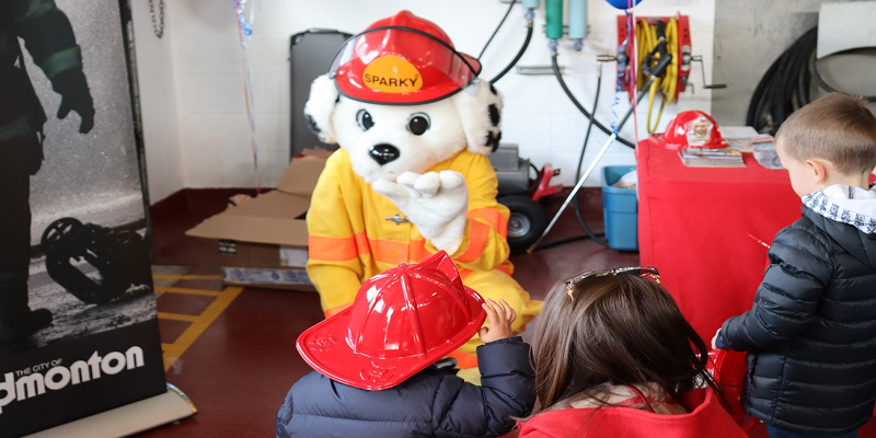 sparky dog mascot with children