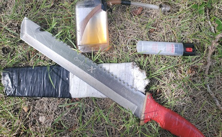 weapon and drug paraphernalia on ground